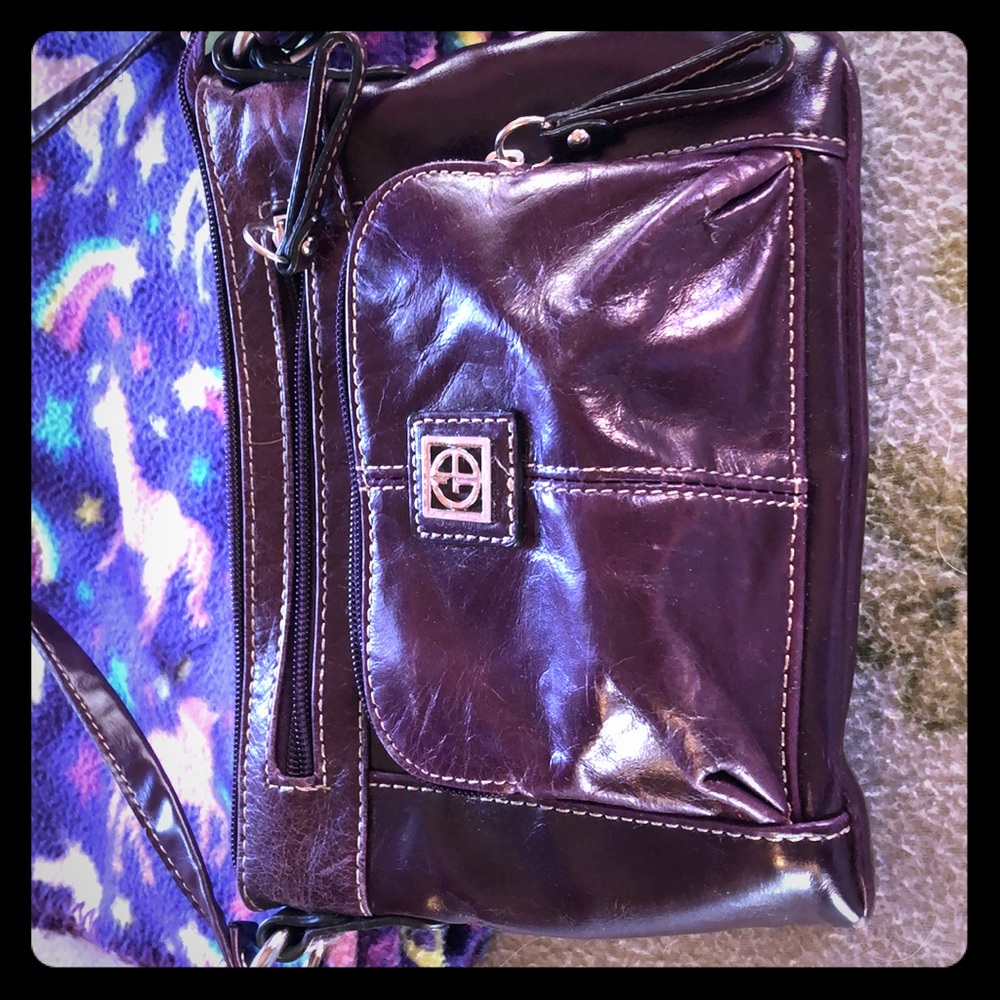 Purple pocketbook it’s Gianibernini